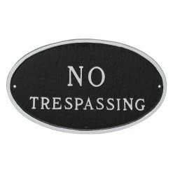 Montague Metal Products 6 in. x 10 in. Small Oval No Trespassing Statement Plaque Sign Black with Silver Lettering